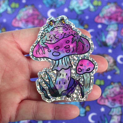 Grumpy Toad on Mushroom Glitter Sticker
